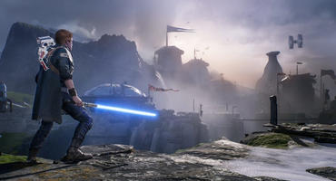 Szene aus Star Wars Jedi Fallen Order. Cal Kestis steht mit blauem Lichtschwert vor einer Basis des Imperiums