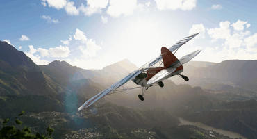 Szene aus Microsoft Flight Simulator: Kleines Flugzeug fliegt über eine Stadt im Gebirge