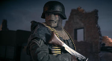 Soldat aus Call of Duty Vanguard steht mit Gewehr vor einer brennenden Häuserruine