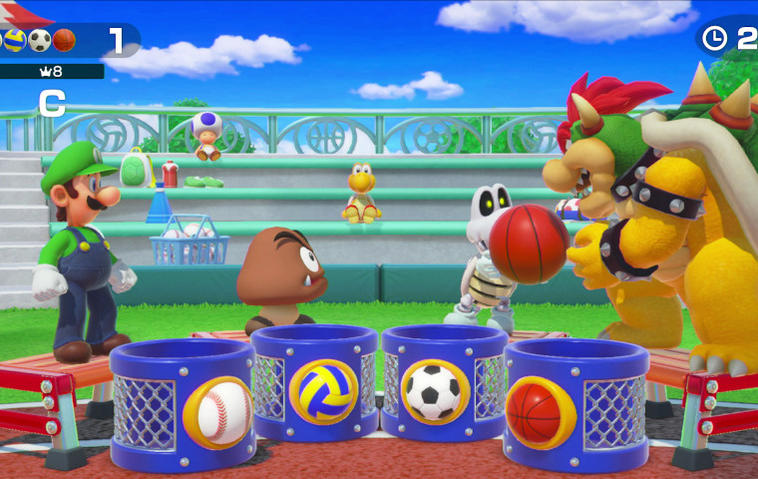 Szene aus Super Mario Party: Luigi, Toad, Goomba und Bowser sortieren Bälle.